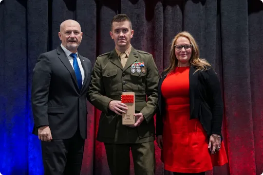 MILAM award winner receiving their award on stage